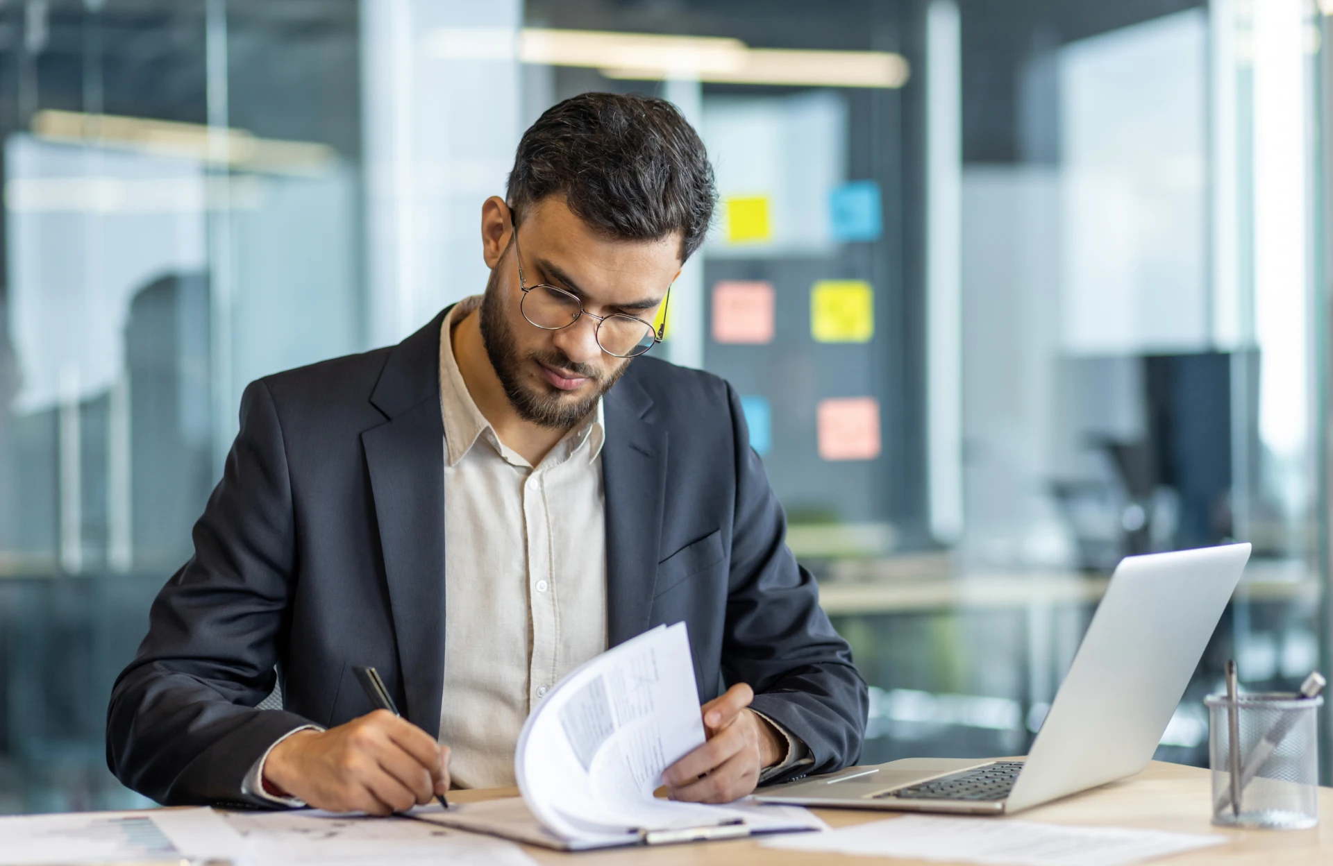 Businessman reviewing documents in office
